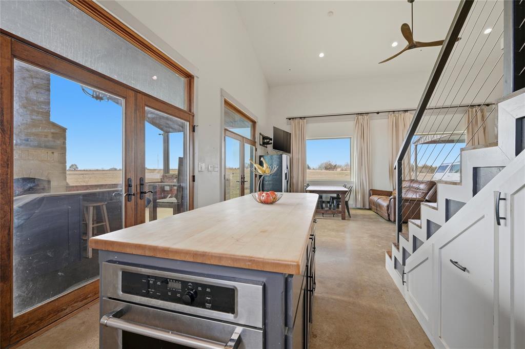 140 Turkey Farm Road Whitesboro, TX 76273 - Photo 10 of 38 a living room with furniture and a table