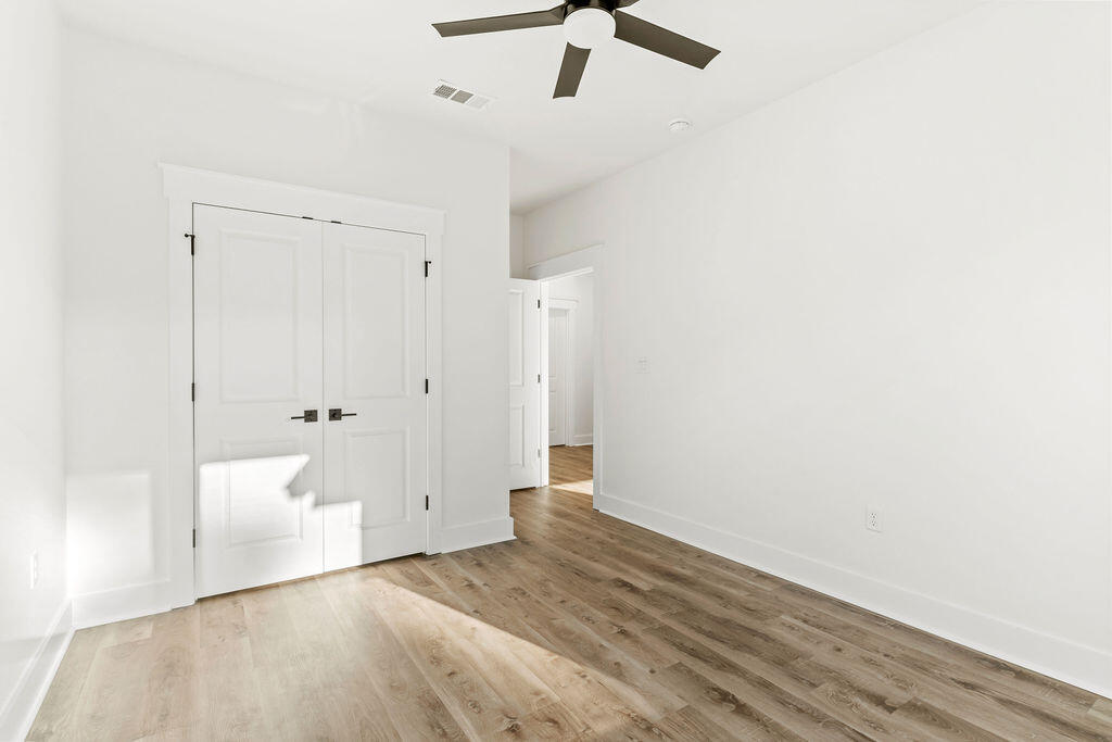 32 22nd Street Santa Rosa Beach, FL 32459 - Photo 20 of 26 an empty room with white wall and ceiling fan