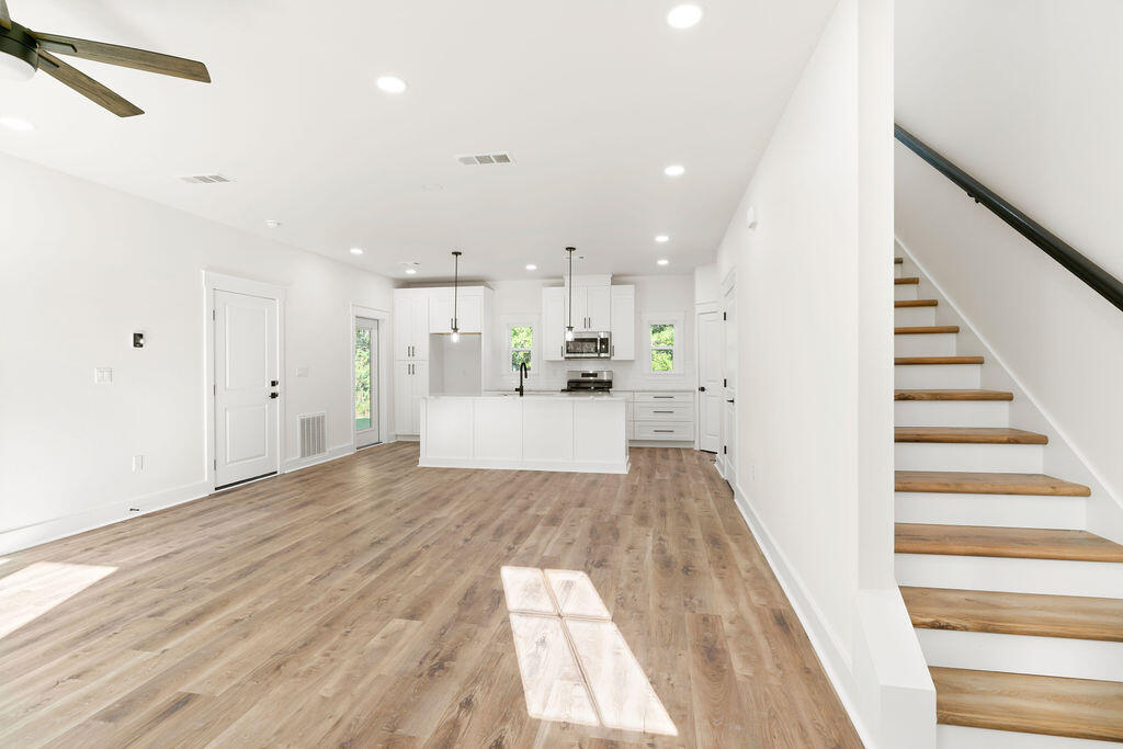 32 22nd Street Santa Rosa Beach, FL 32459 - Photo 2 of 26 a view of a kitchen with wooden floor and electronic appliances