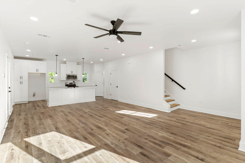 32 22nd Street Santa Rosa Beach, FL 32459 - Photo 3 of 26 a view of kitchen and empty room with wooden floor