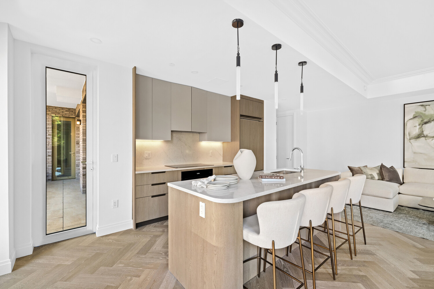 78-29 Austin Street, Unit 202 Queens, NY 11375 - Photo 6 of 32 a kitchen with stainless steel appliances kitchen island granite countertop a table chairs and a refrigerator