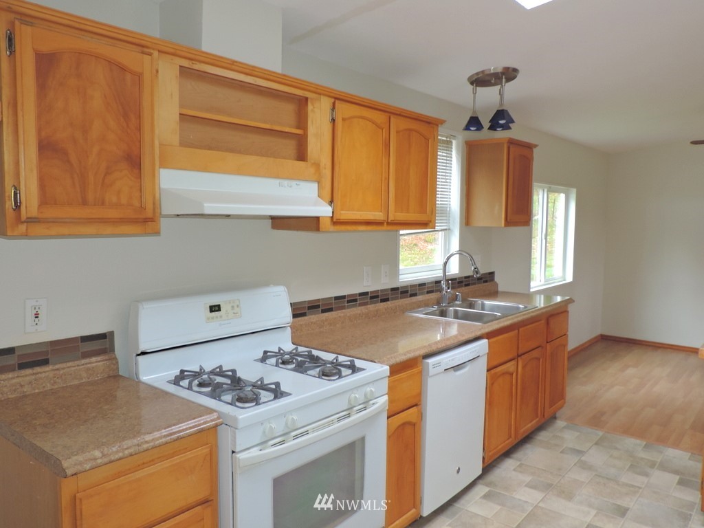 360 Hewitt Road Chehalis, WA 98532 - Photo 3 of 25 a kitchen with a stove and a sink
