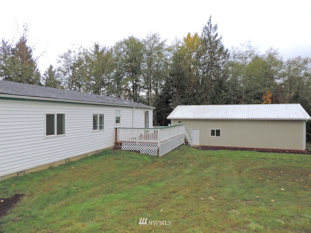360 Hewitt Road Chehalis, WA 98532 - Photo 22 of 25 a white house that has a tree in front of it