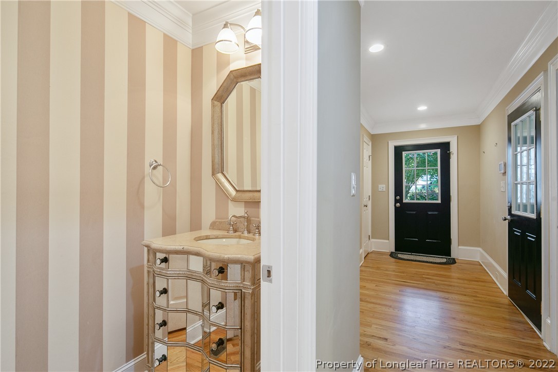 501 Rush Road Fayetteville, NC 28305 - Photo 18 of 50 a view of a hallway with wooden floor and windows