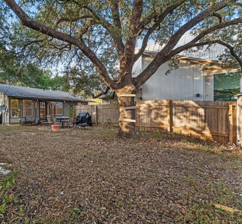 5413 Duval Street Austin, TX 78751 - Photo 26 of 27 a view of a yard with a house and a large tree
