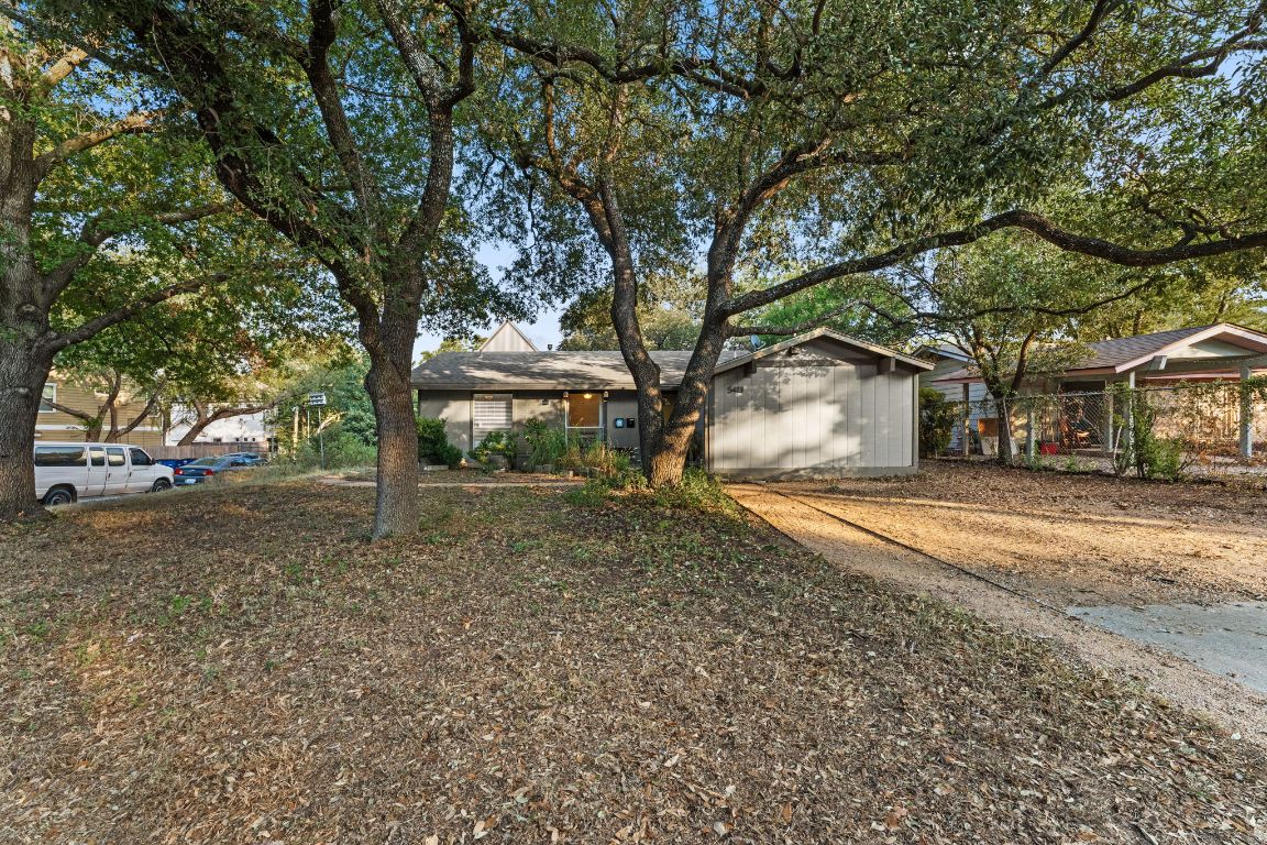 5413 Duval Street Austin, TX 78751 - Photo 3 of 27 a house with trees in front of it
