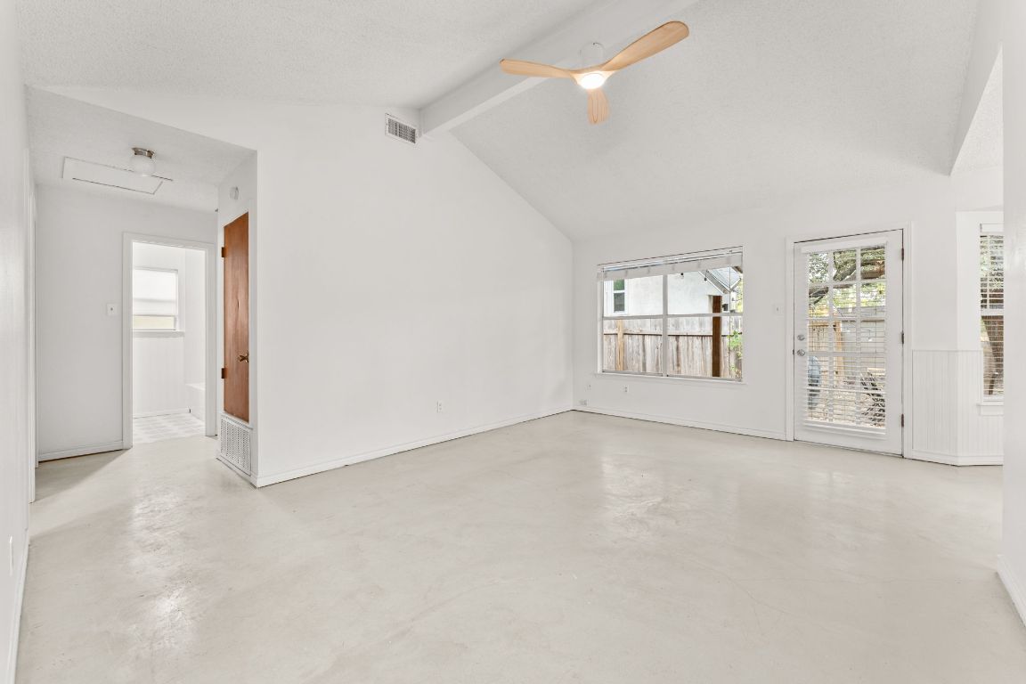 5413 Duval Street Austin, TX 78751 - Photo 6 of 27 an empty room with windows and closet