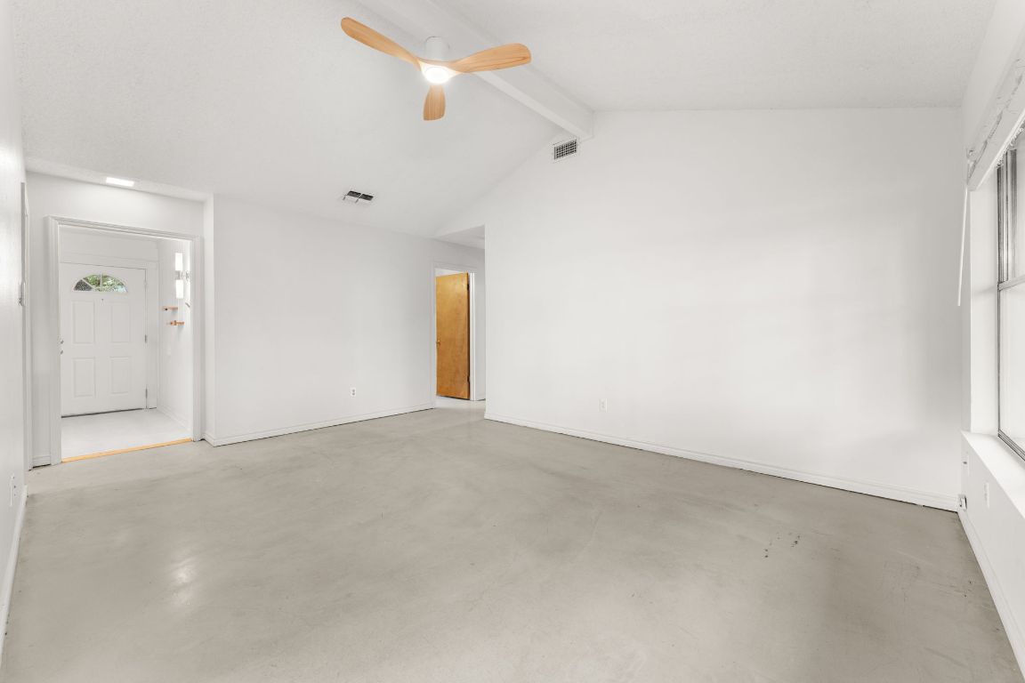 5413 Duval Street Austin, TX 78751 - Photo 7 of 27 an empty room with a fan & a window