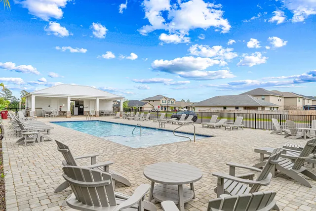 a view of a swimming pool and a chairs