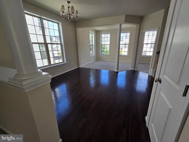 a view of livingroom with window and hardwood floor