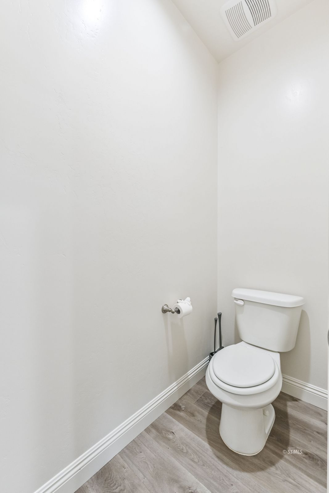 1031 West Church Avenue Ridgecrest, CA 93555 - Photo 33 of 49 a white toilet sitting next to a white wall