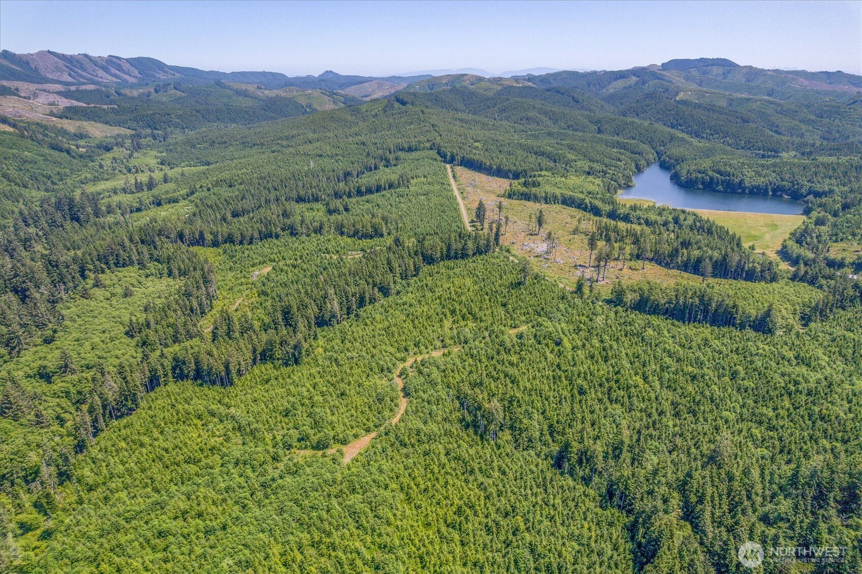 0 Walberg Road Chinook, WA 98614 - Photo 14 of 29 a view of a lush green hillside and a building