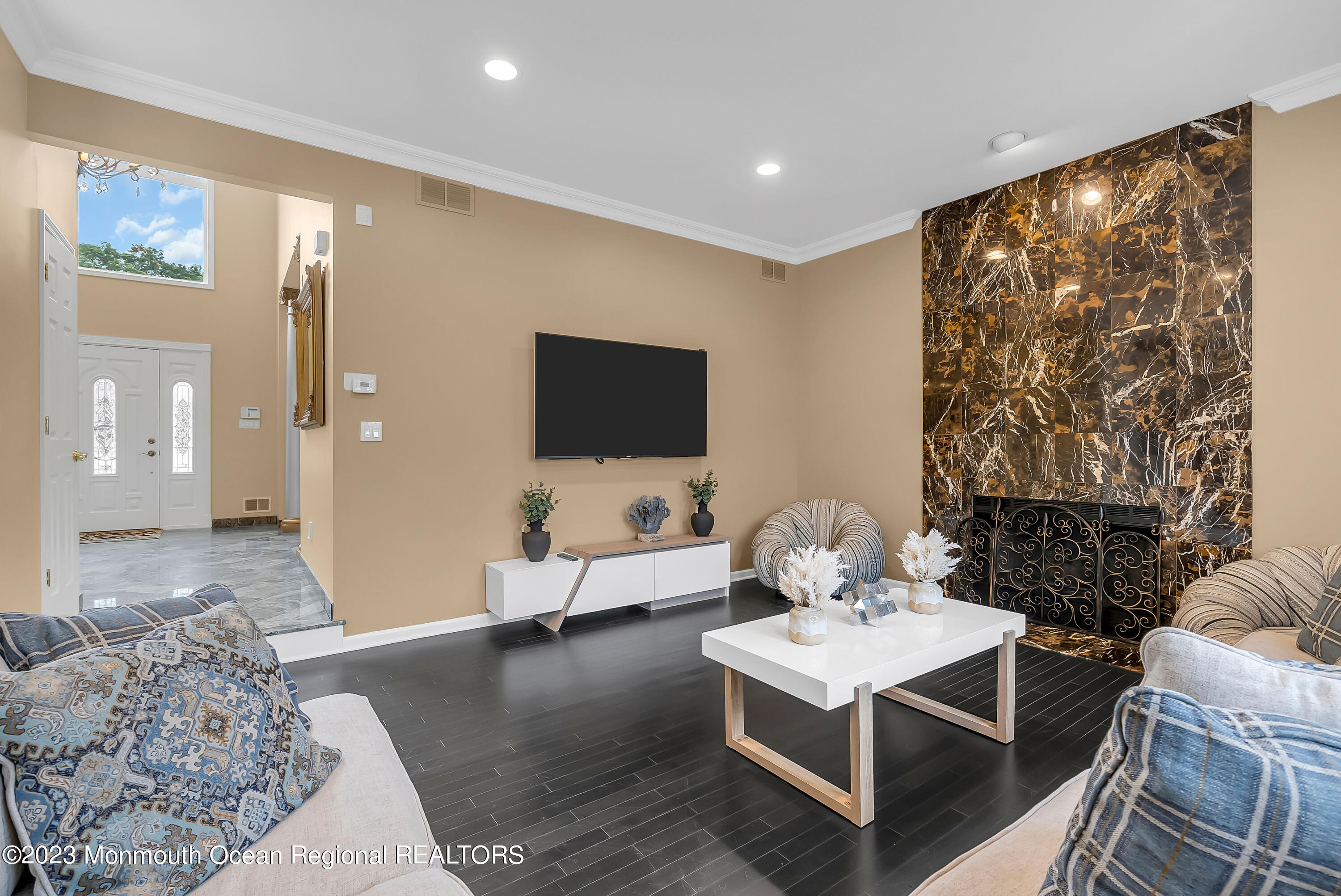 7 MacKenzie Road Eatontown, NJ 07724 - Photo 11 of 42 a living room with furniture and a flat screen tv