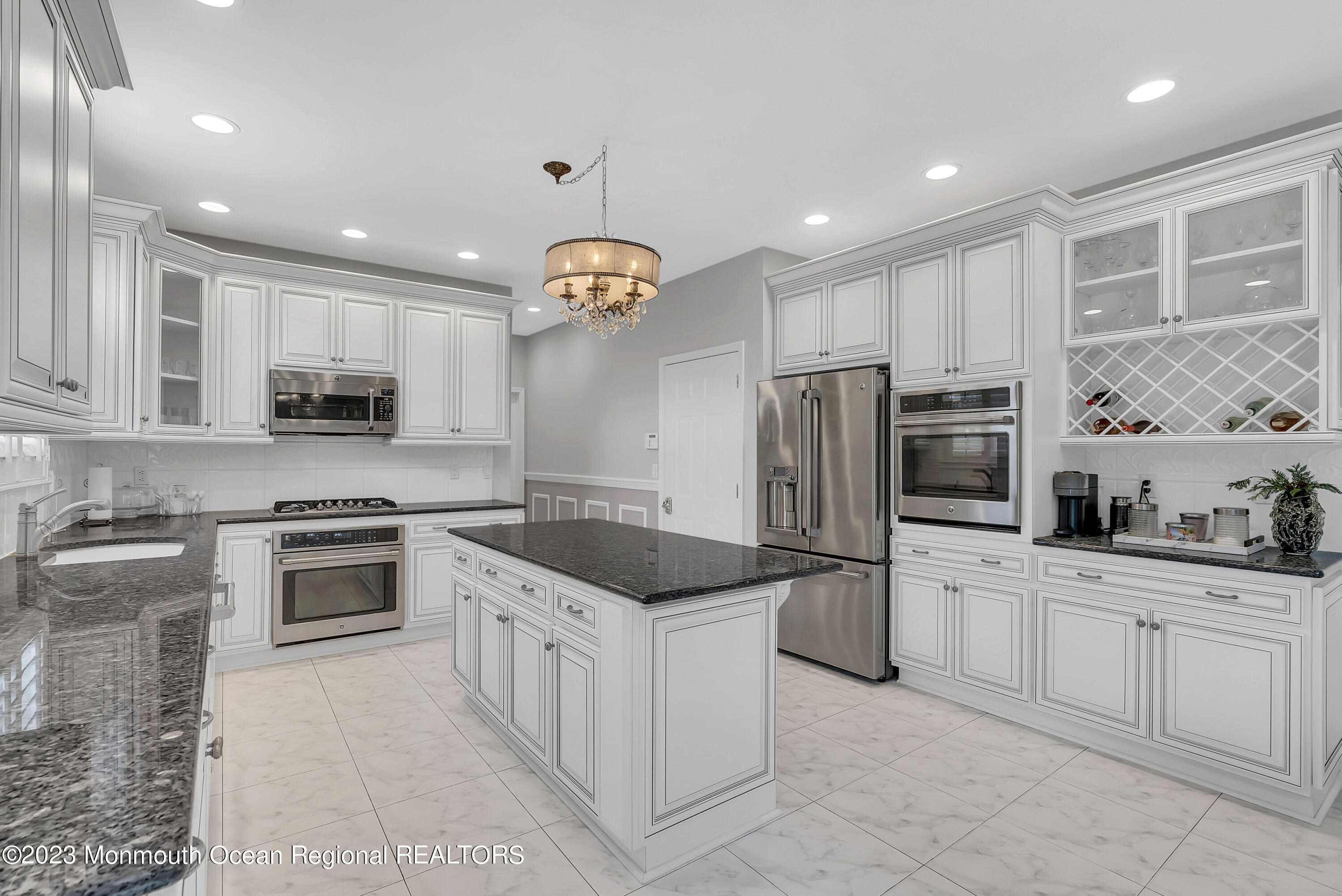 7 MacKenzie Road Eatontown, NJ 07724 - Photo 15 of 42 a kitchen with white cabinets and stainless steel appliances
