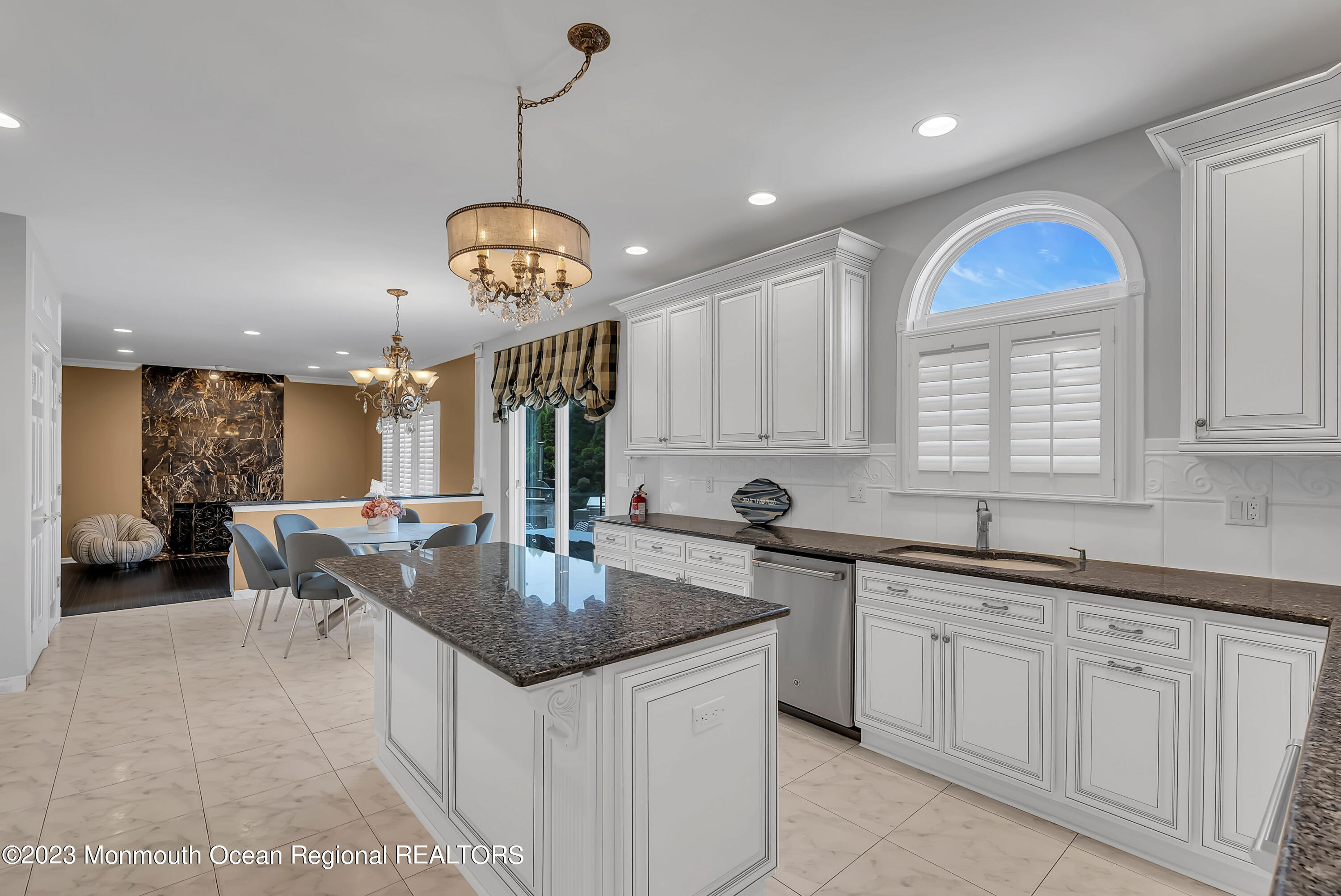 7 MacKenzie Road Eatontown, NJ 07724 - Photo 18 of 42 a kitchen with center island a sink appliances and a window