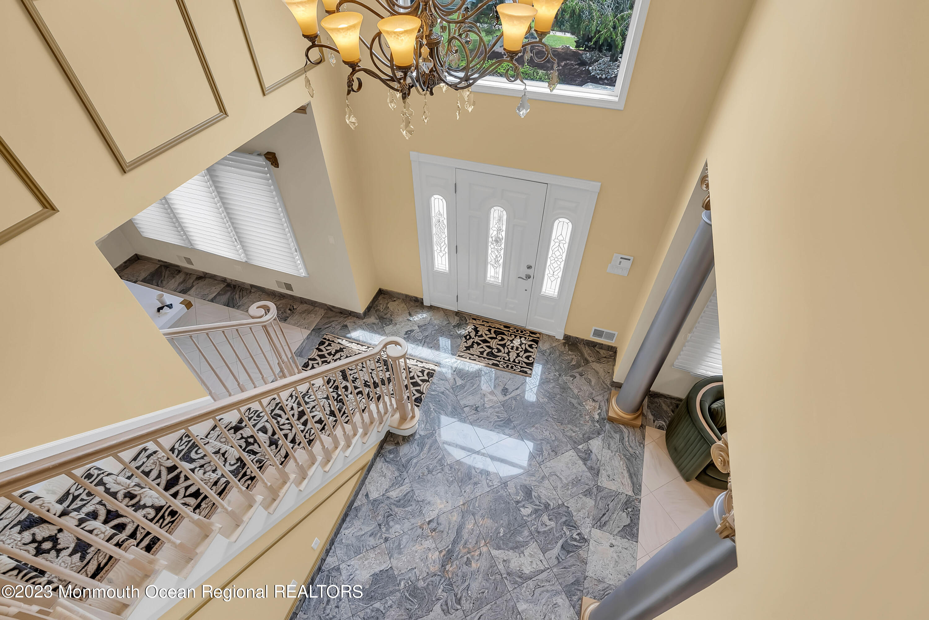 7 MacKenzie Road Eatontown, NJ 07724 - Photo 23 of 42 a view of staircase with white walls and a window