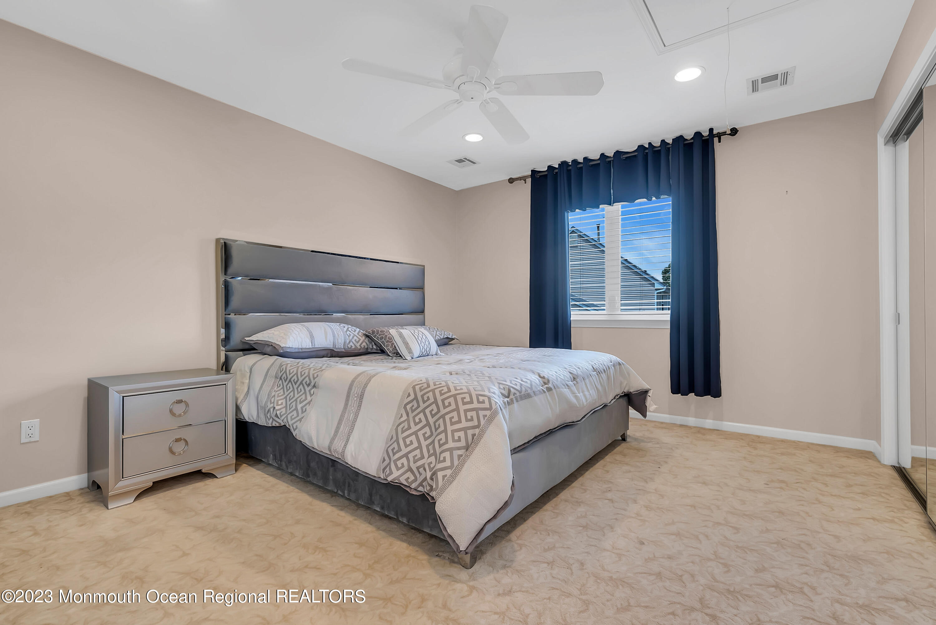 7 MacKenzie Road Eatontown, NJ 07724 - Photo 25 of 42 a bedroom with a bed and a night stand