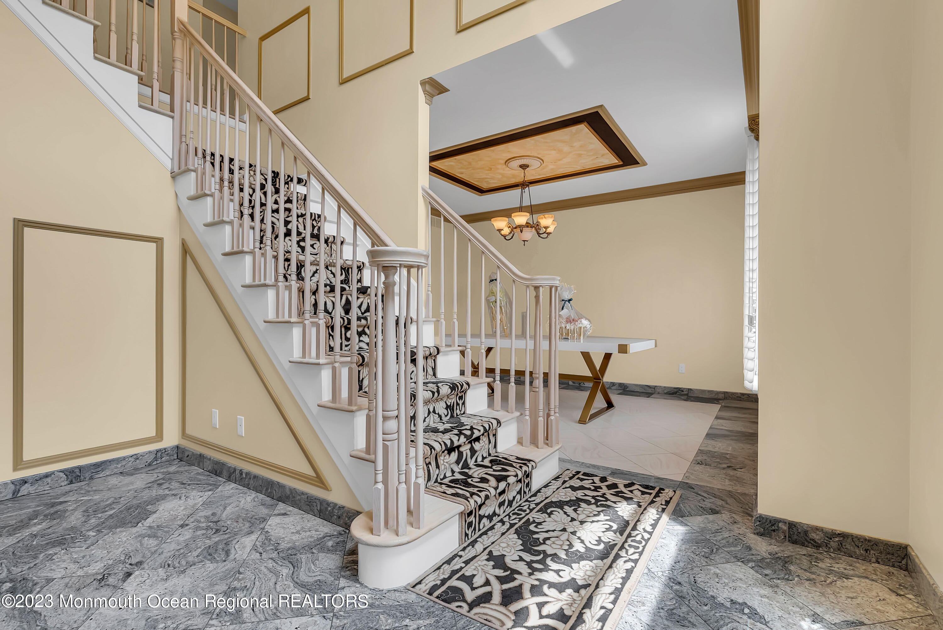 7 MacKenzie Road Eatontown, NJ 07724 - Photo 5 of 42 a view of entryway dining room and hall with wooden floor