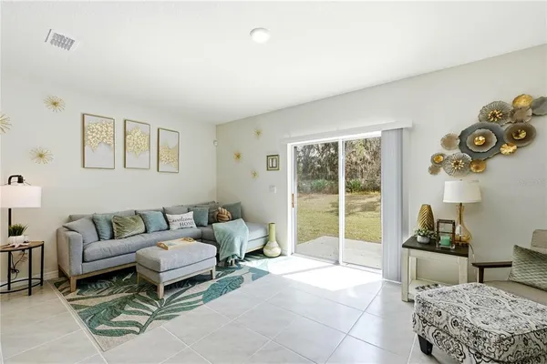 a living room with furniture and a window