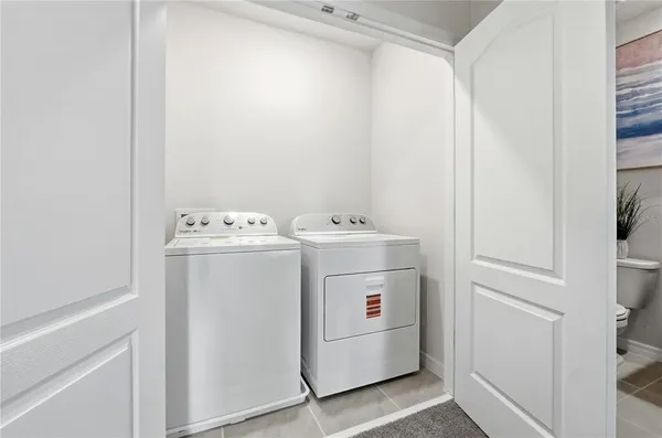 a utility room with dryer and washer