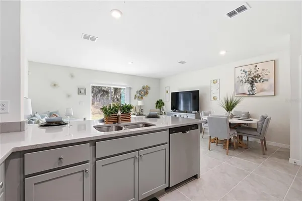a kitchen with a sink and cabinets