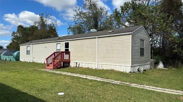 a view of a back yard of the house