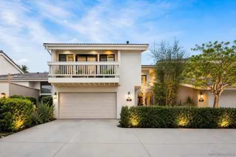 front view of a house with a garden