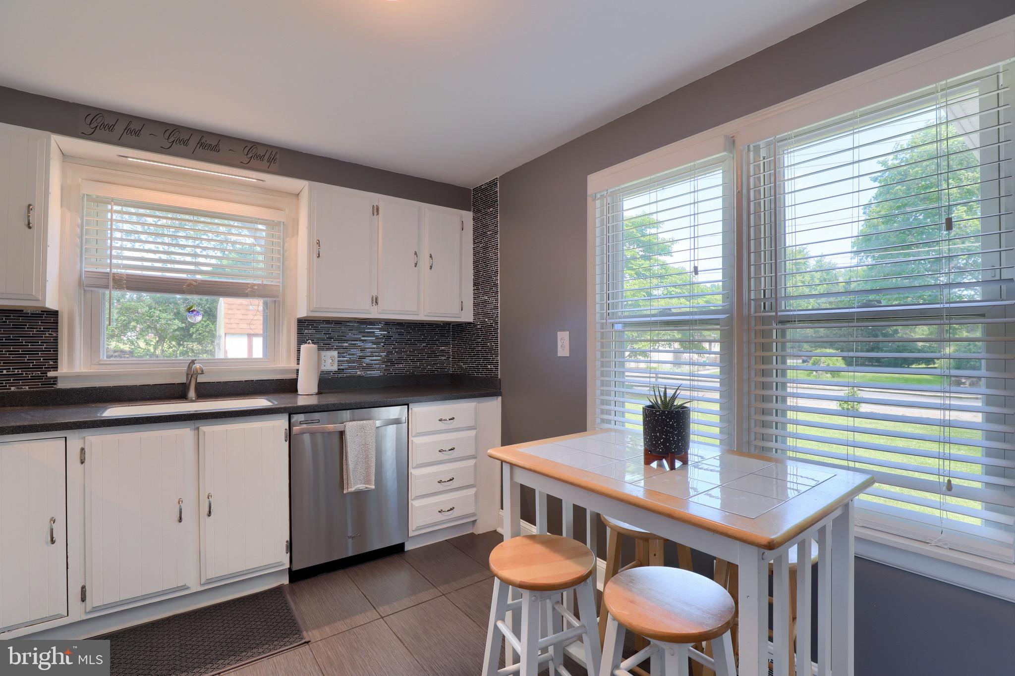 265 Noble Street Lititz, PA 17543 - Photo 22 of 35 a kitchen with a sink a window and chairs