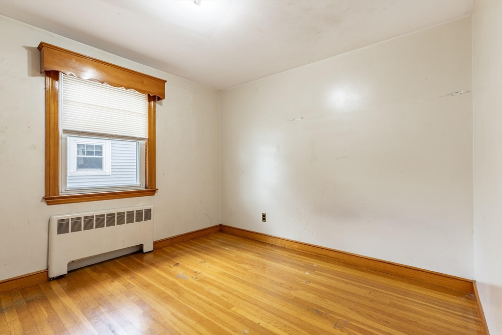 17 Albert Park Everett, MA 02149 - Photo 18 of 40 an empty room with wooden floor and windows