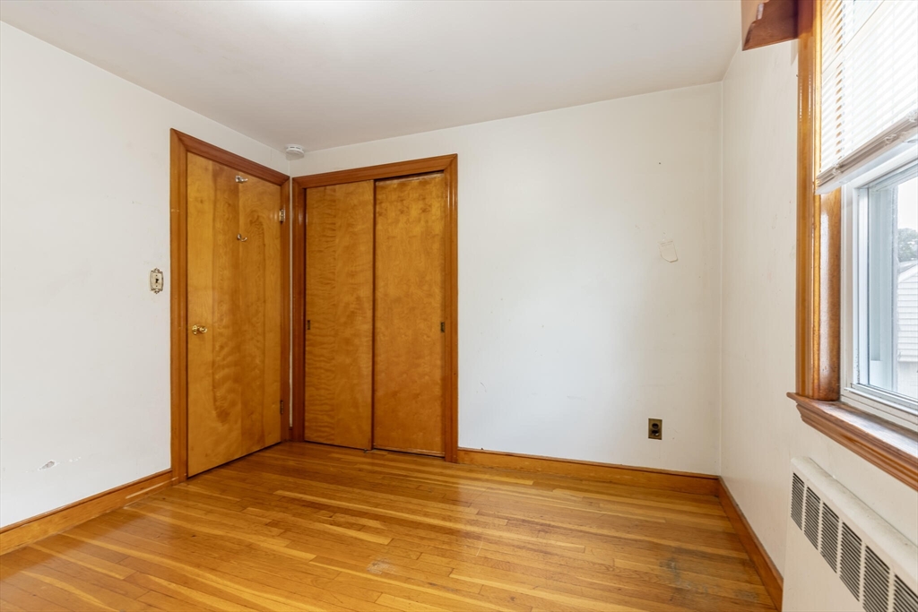 17 Albert Park Everett, MA 02149 - Photo 19 of 40 a view of an empty room with wooden floor and a window