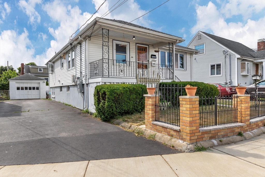 17 Albert Park Everett, MA 02149 - Photo 2 of 40 a front view of a house with garage