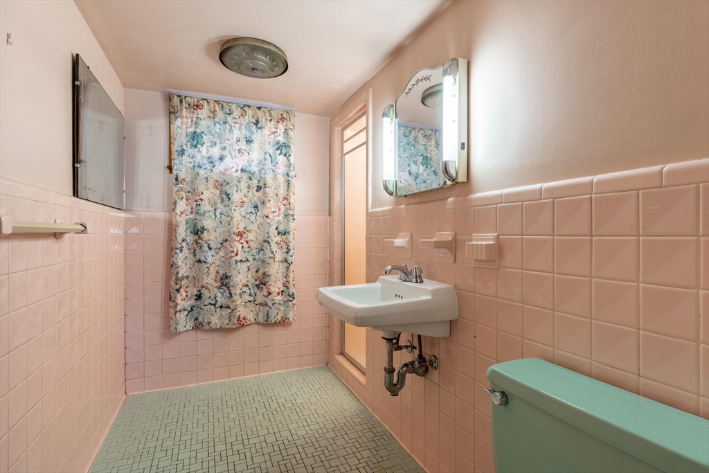 17 Albert Park Everett, MA 02149 - Photo 30 of 40 a bathroom with a toilet sink and shower