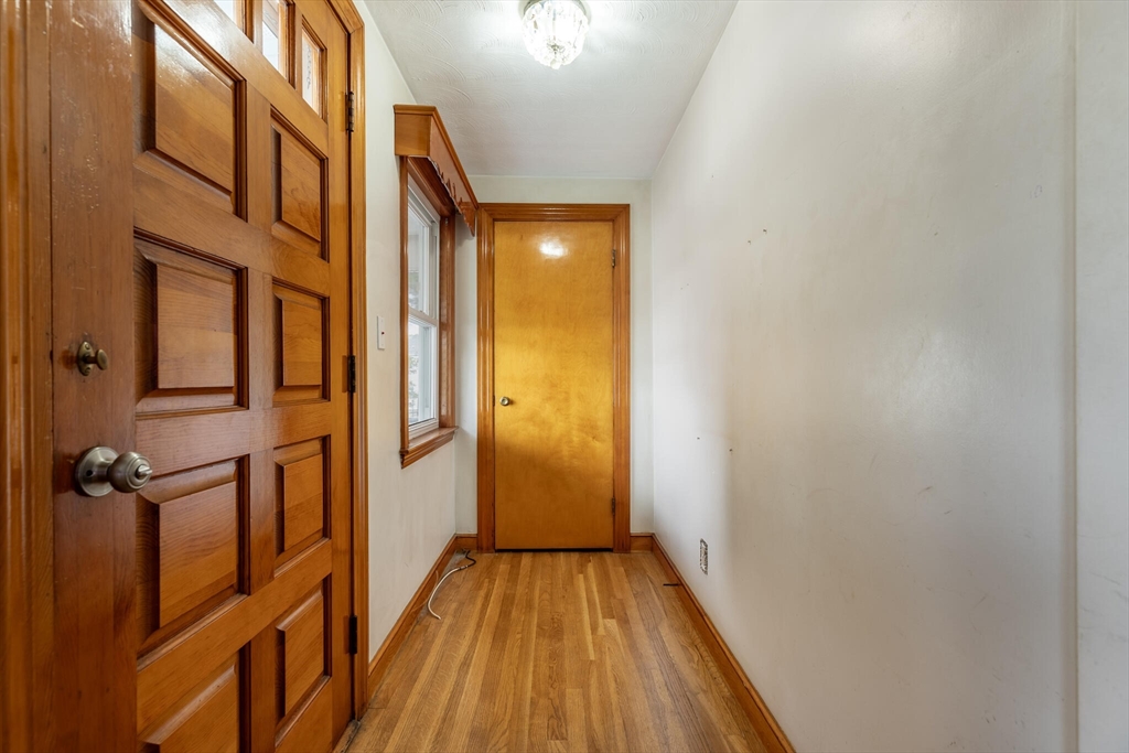 17 Albert Park Everett, MA 02149 - Photo 6 of 40 a view of a hallway with wooden floor and staircase