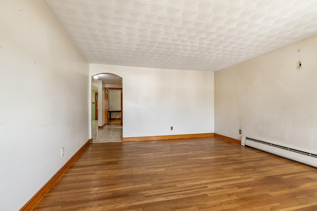 17 Albert Park Everett, MA 02149 - Photo 7 of 40 a view of an empty room with wooden floor