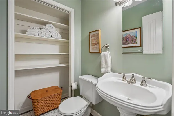 a view of a lake with houses in the back