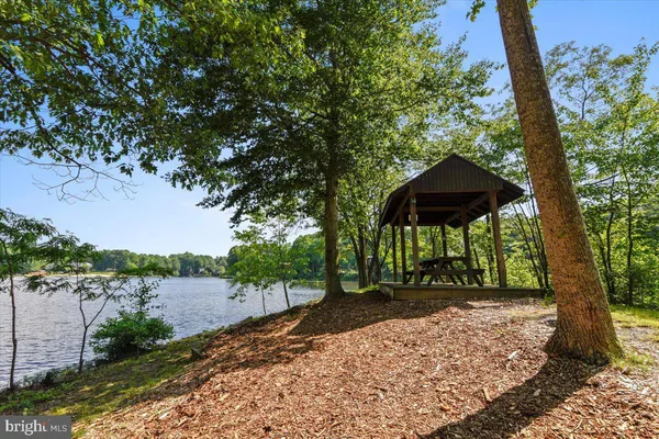 a large kitchen with a table and chairs