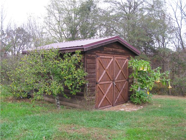 19 Slaterock Mill Road Taft, TN 38488 - Photo 3 of 20 a view of a wooden house with a small yard and large trees