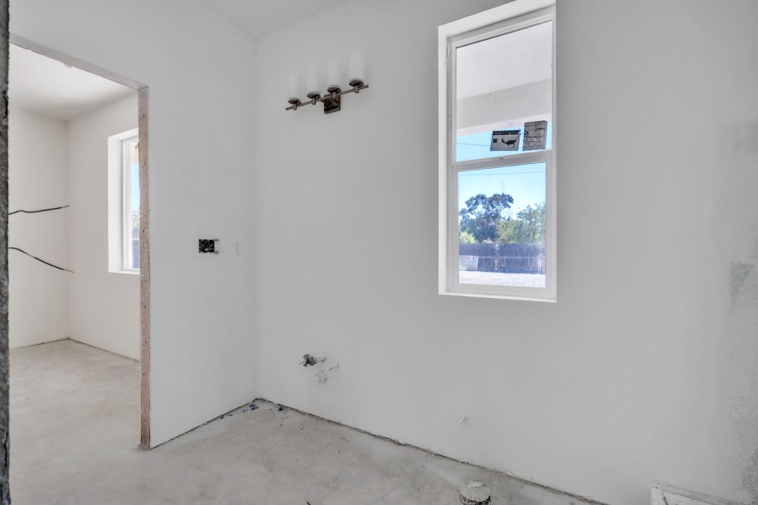 4688 Pacific Avenue Olivehurst, CA 95961 - Photo 22 of 91 an empty room that has a painting on the wall