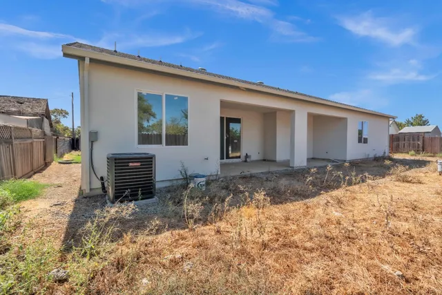 an aerial view of residential house with outdoor space