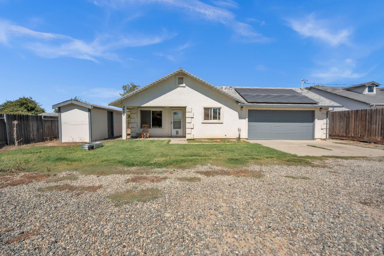4688 Pacific Avenue Olivehurst, CA 95961 - Photo 28 of 91 a front view of a house with a garden and yard