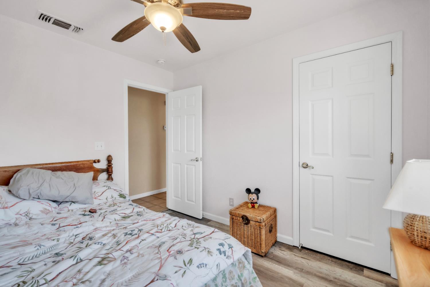 4688 Pacific Avenue Olivehurst, CA 95961 - Photo 38 of 91 a bedroom with a bed and a chandelier