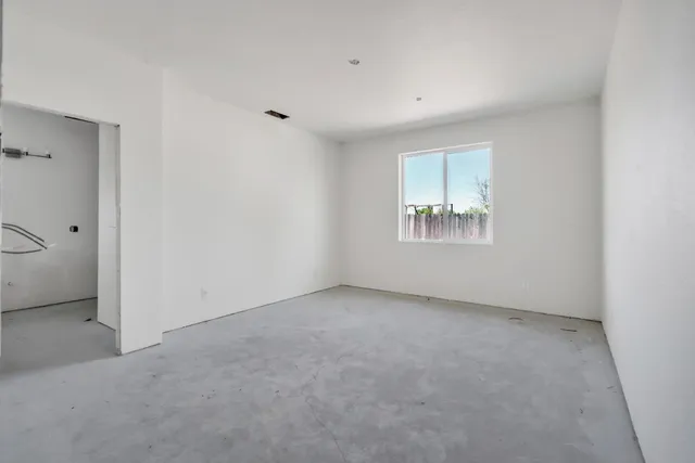 a kitchen with a refrigerator and cabinets
