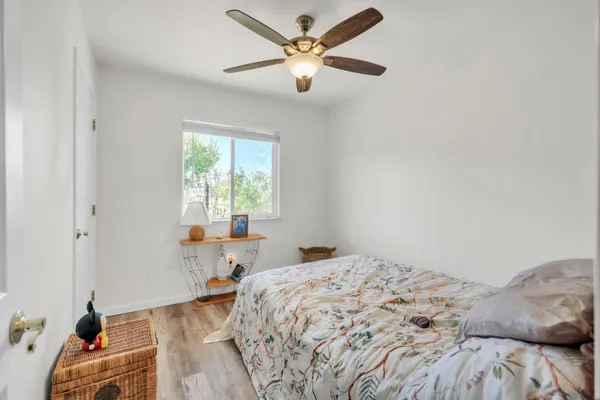 a kitchen with stainless steel appliances granite countertop a sink counter space cabinets and a large window