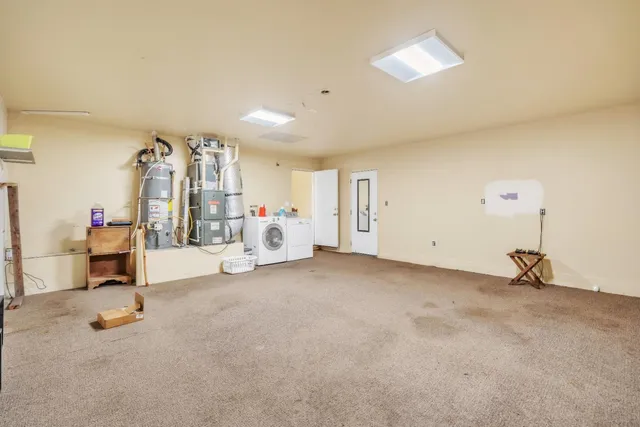 a view of a livingroom with furniture and a window