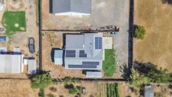 an aerial view of residential houses with outdoor space