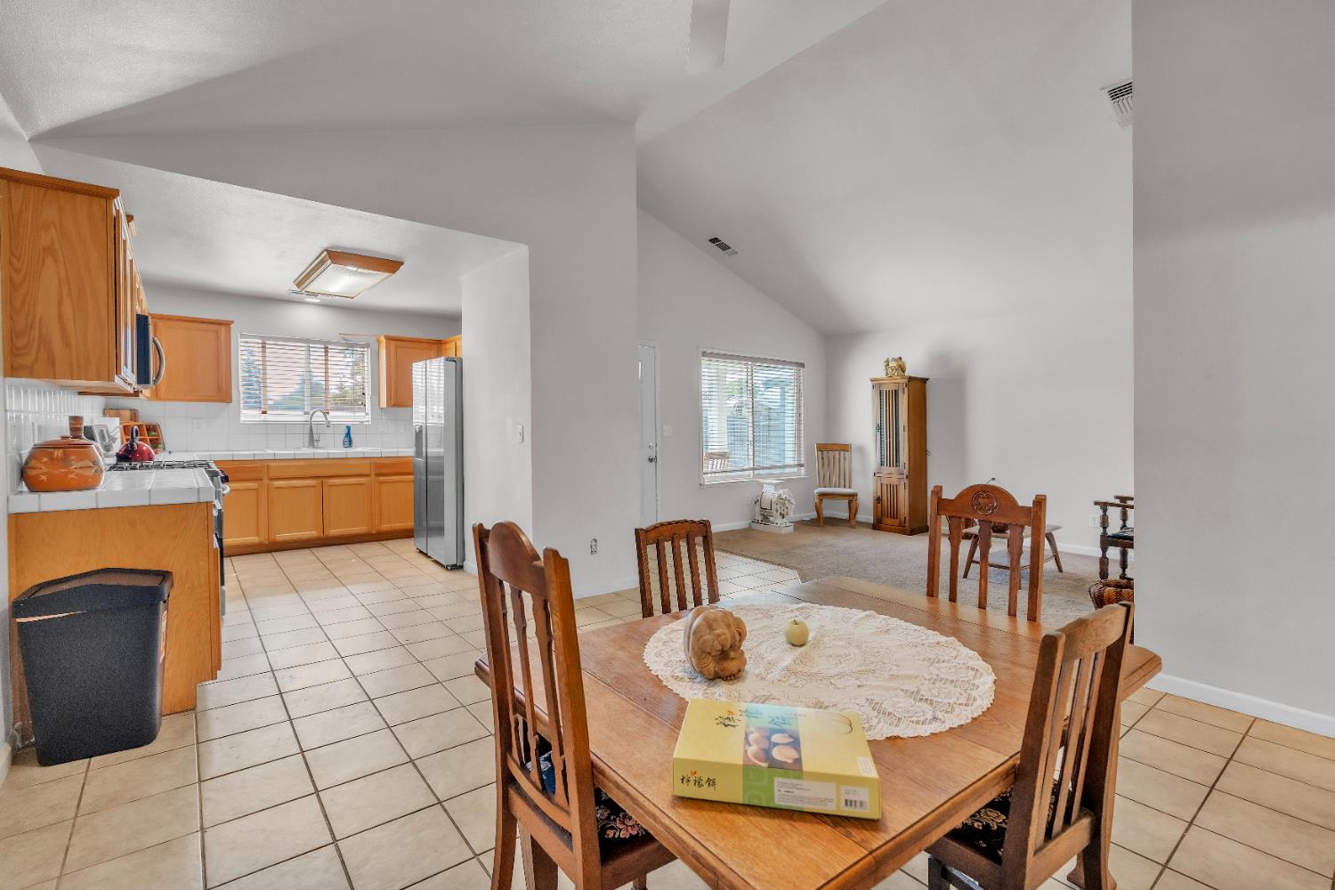 4688 Pacific Avenue Olivehurst, CA 95961 - Photo 77 of 91 a view of a dining room with furniture and chandelier