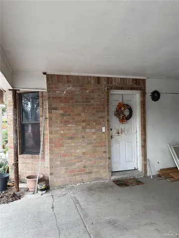 a view of a door and chair in a room