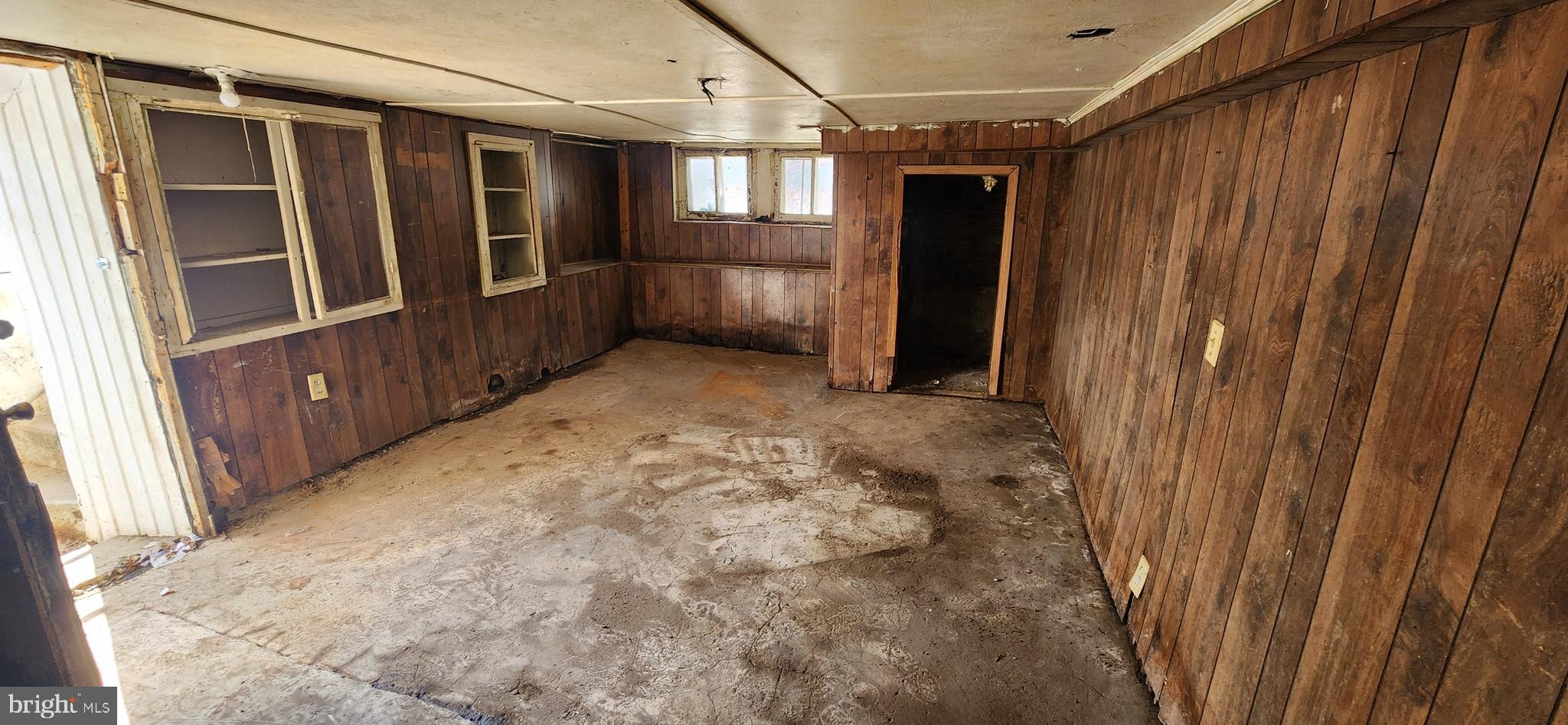 1746 East Oliver Street Baltimore, MD 21213 - Photo 14 of 17 a view of an empty room with stairs