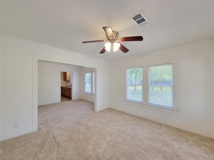 a view of an empty room with a window