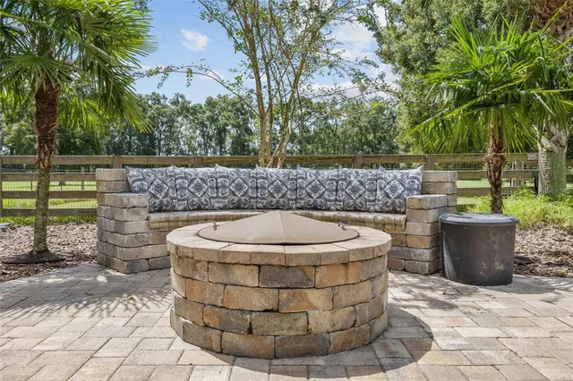 a bedroom with furniture and a large window